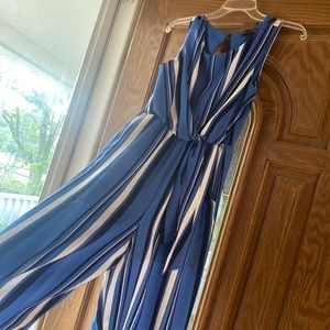 As You Wish: Blue, vertical striped romper. Knotted waist detail, wide legged.